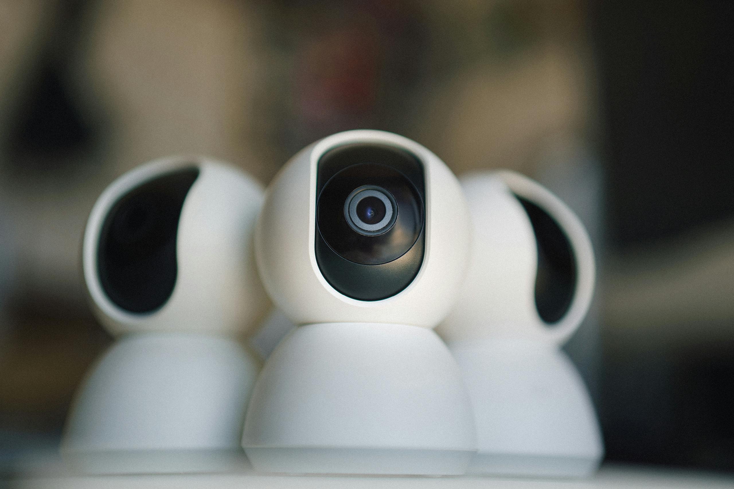 Close-up of sleek security cameras ensuring safety and privacy in indoor settings.
